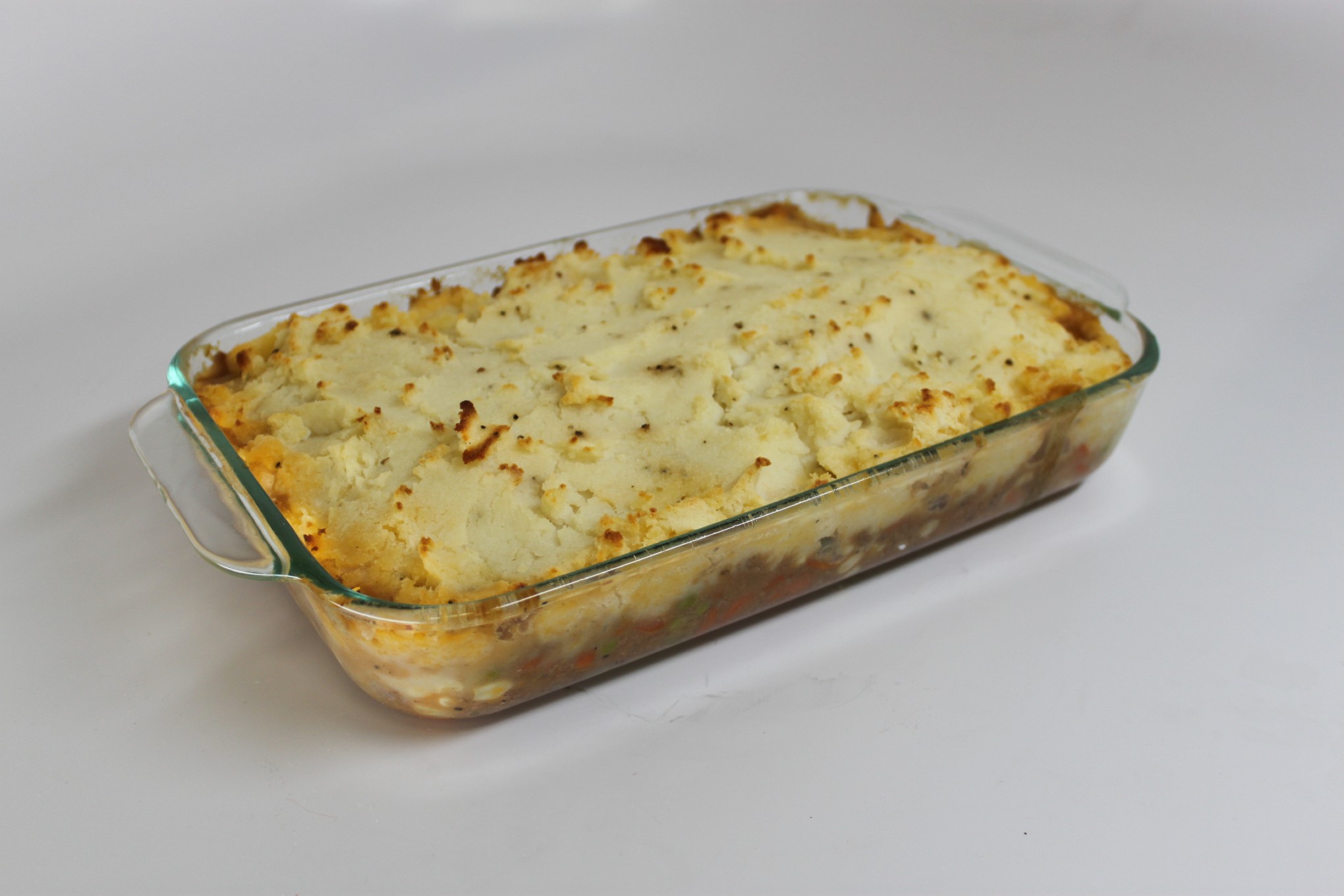 Shepherd's pie in a glass baking dish on the set of Good Eats.