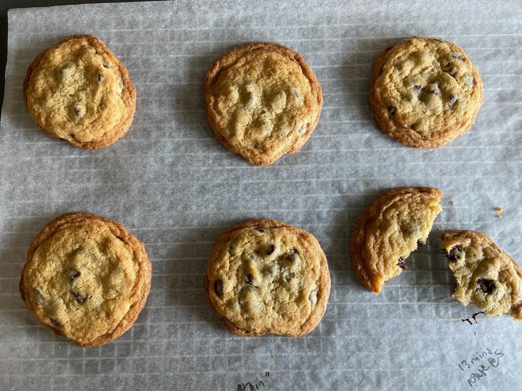 The Thin Chocolate Chip Cookie on a parchment paper-lined wire rack
