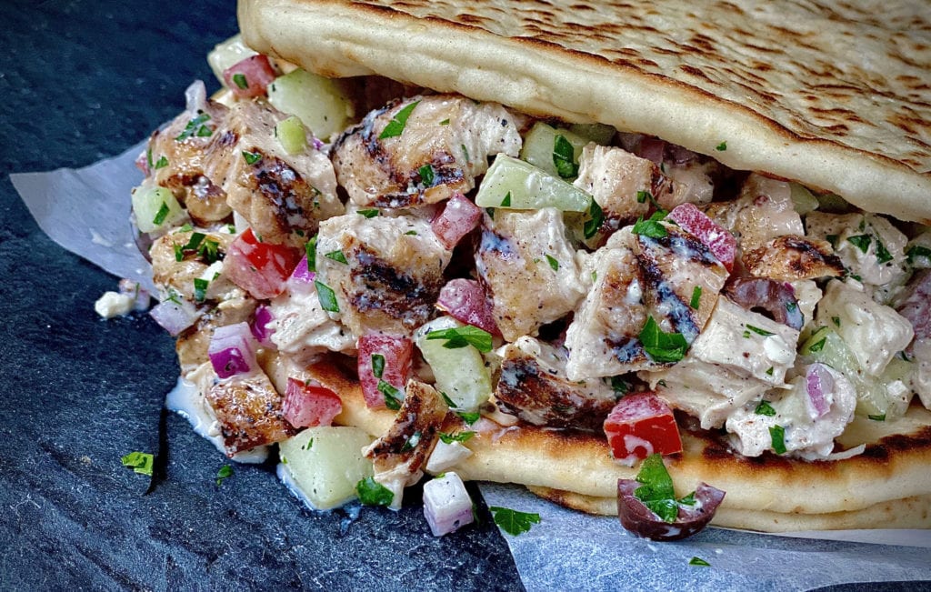 Greek chicken salad with grilled chicken, olives, feta cheese, and Greek dressing
