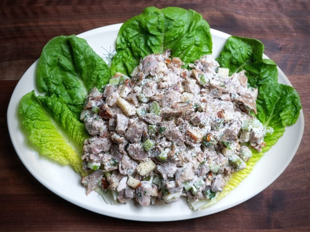 Smoked turkey salad on lettuce cups on white plate