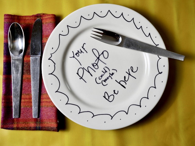 A white plate with the text "your photo could be here" written in Alton Brown's handwriting.