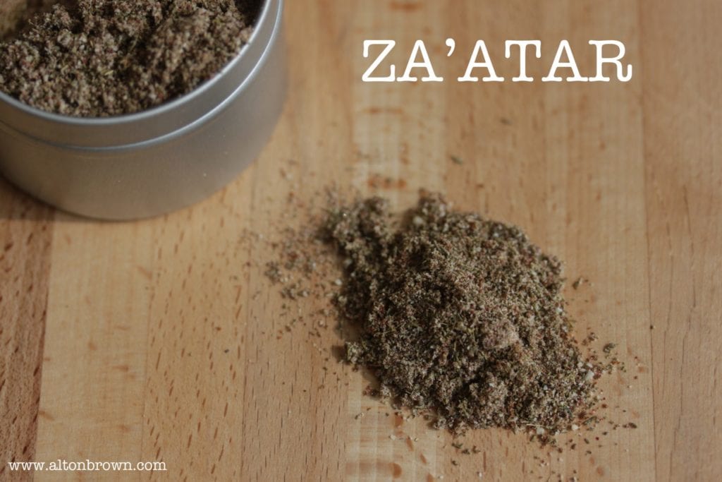 Za'atar on a butcher block cutting board on the set of Alton Brown's Good Eats.