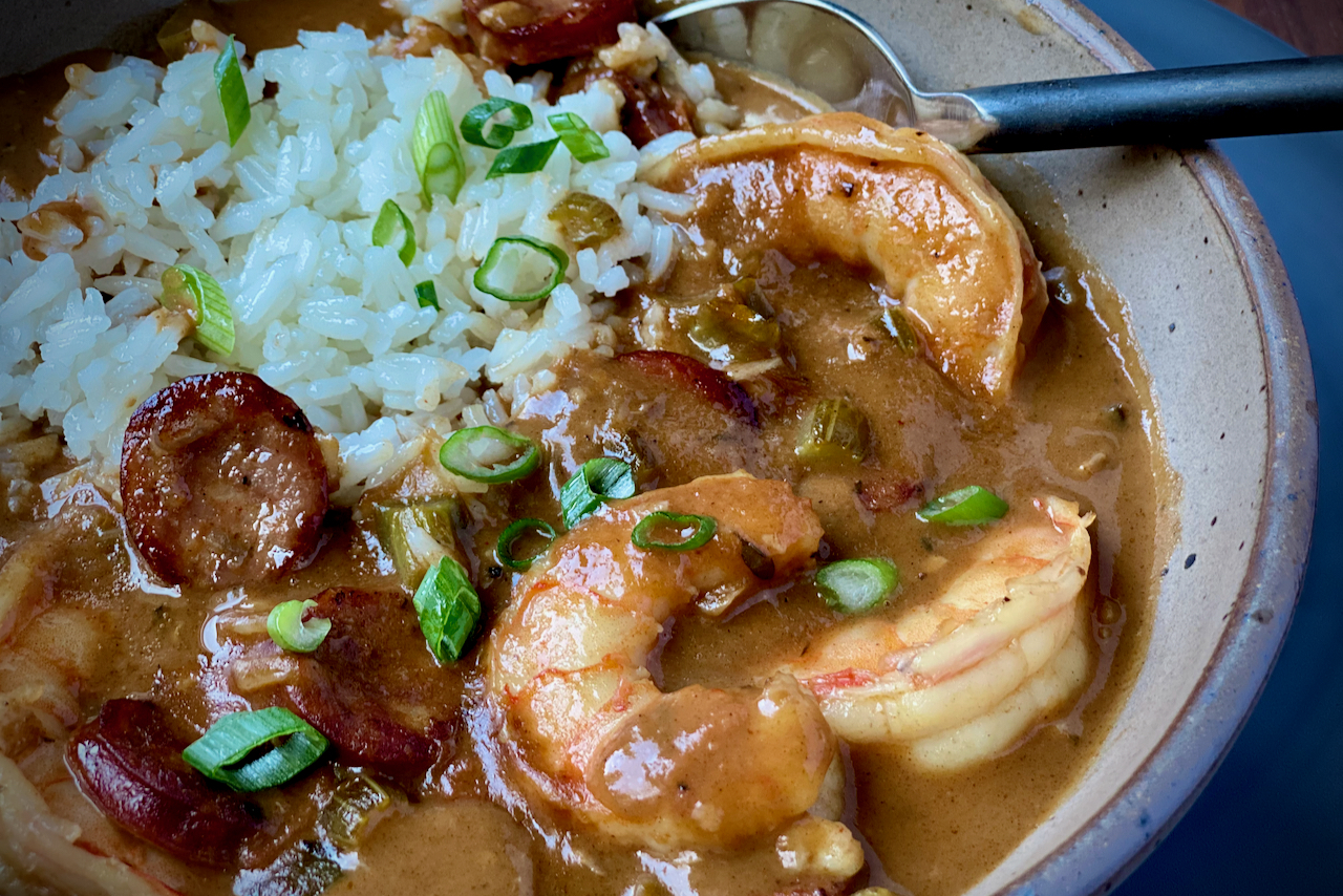 Cajun-style gumbo with homemade shrimp stock, filé powder, shrimp, and sausage served over a bed of rice